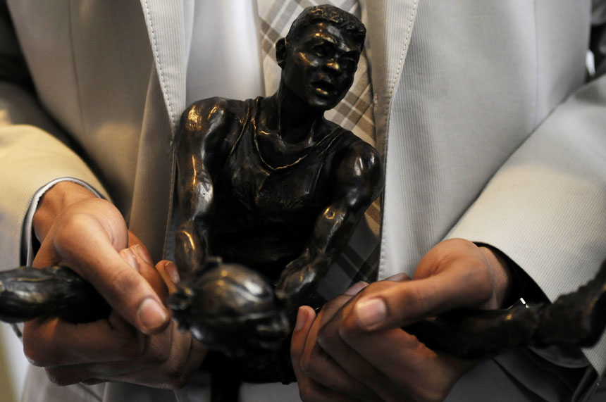 Ohio State's Evan Turner holds the Oscar Robinson College Player of the Year Award after a United States Basketball Writers Association breakfast on Friday, April 2, 2010, at the Columbia Club in downtown Indianapolis. (James Brosher / IU Student News Bureau)