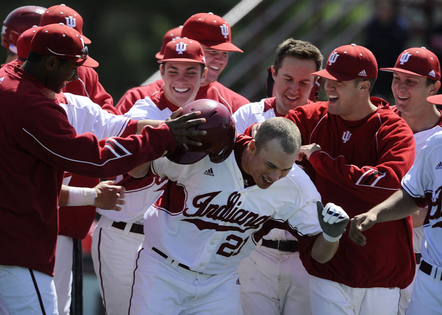 Indiana players congratulate teammate Josh Lyon (21) after he hit a solo homerun during the first game in a double header against Iowa on Saturday, April 17, 2010, at Sembower Field.