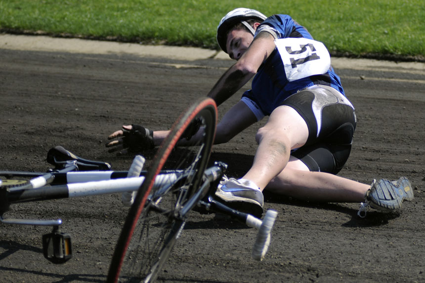 Evans Scholars rider David Osborn falls to the ground during a Little 500 Miss-N-Out heat race on Saturday, April 10, 2010, at Bill Armstrong Stadium.
