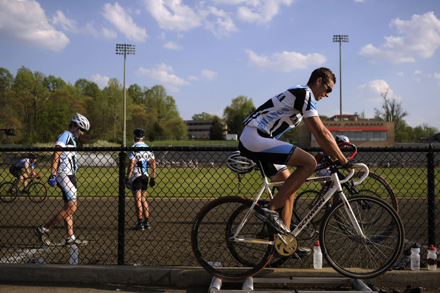 Emanon rider Justin Haviar, right, stays loose off the track by rider on rollers during an afternoon  practice session for the Men's Little 500 on Thursday, April 15, 2010, at Bill Armstrong Stadium.