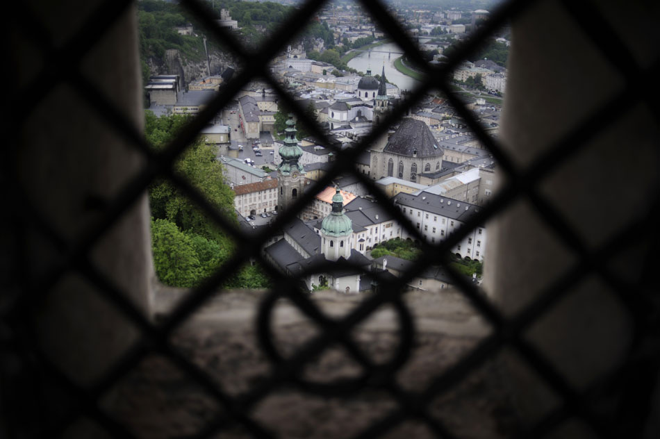 Salzburg's Old Town is seen through window bars inside the city's famed Festung (Fortress) on Friday, May 21, 2010, in Salzburg, Austria.