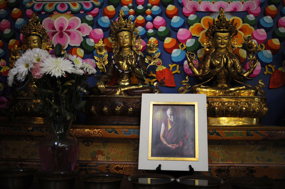 A portrait of the Dalai Lama is seen in the main temple on Saturday, May 8, 2010, at the Bloomington Tibetan Mongolian Buddhist Cultural Center. The temple will welcome the Dalai Lama on May 12 and 13.