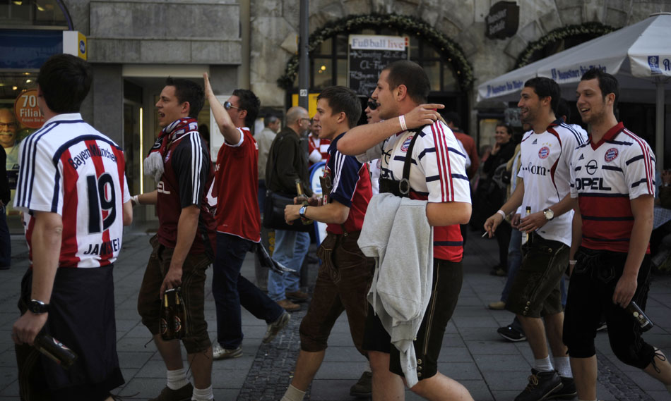 Bayern München fans walk through downtown on Saturday, May 22, 2010, in Munich, Germany.