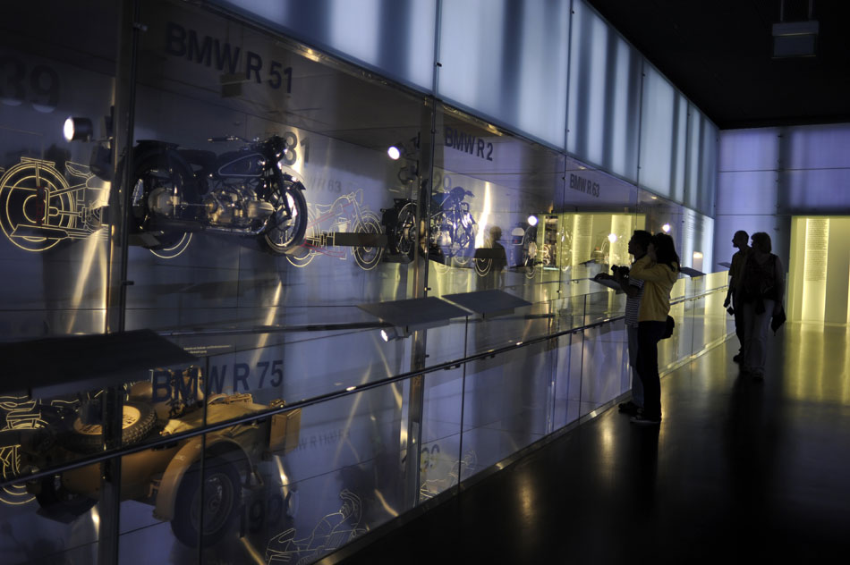 Visitors look at several types of BMW motorcycles in display on Monday, May 24, 2010, in the company's Munich museum.