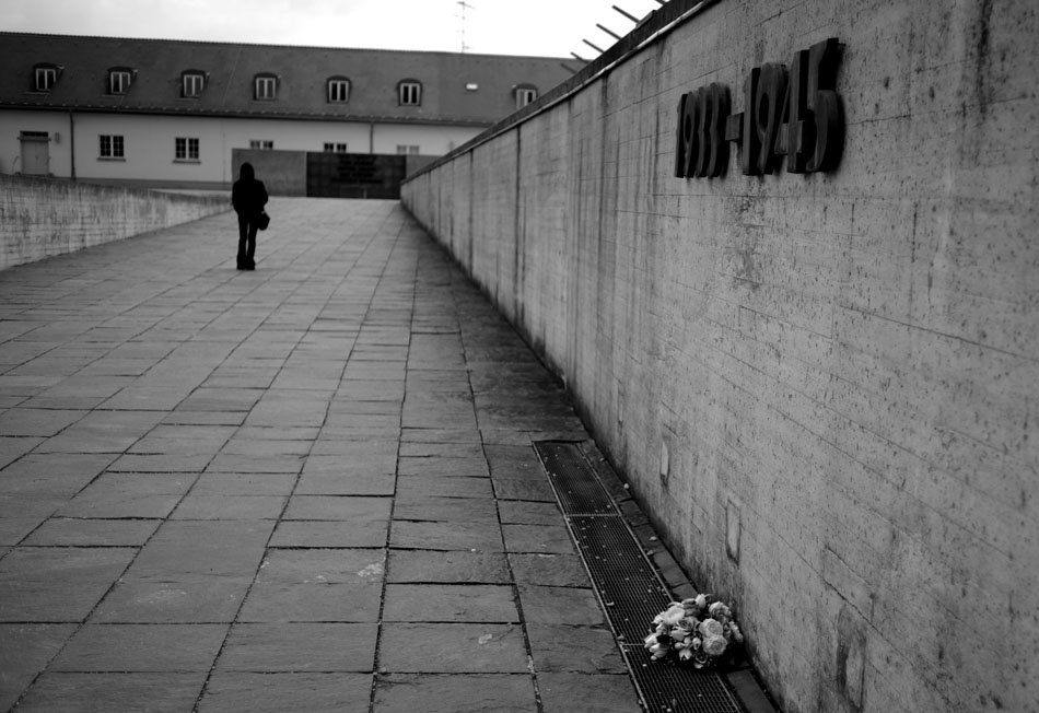 A single bouquet of flowers sits at a memorial on Saturday, May 22, 2010, at the Dachau Concentration Camp in Dachau, Germany. The former camp was converted into a memorial and museum in the 1960s.