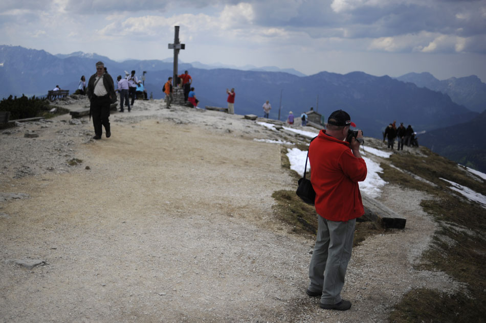 A visitor films the sights from an area near the Kehlsteinhaus (Eagle's Nest) on Tuesday, May 25, 2010, near Berchtesgaden, Germany. Although given as a present to Adolf Hitler by the Nazi party, the house was sparingly used as a place to greet heads of state.
