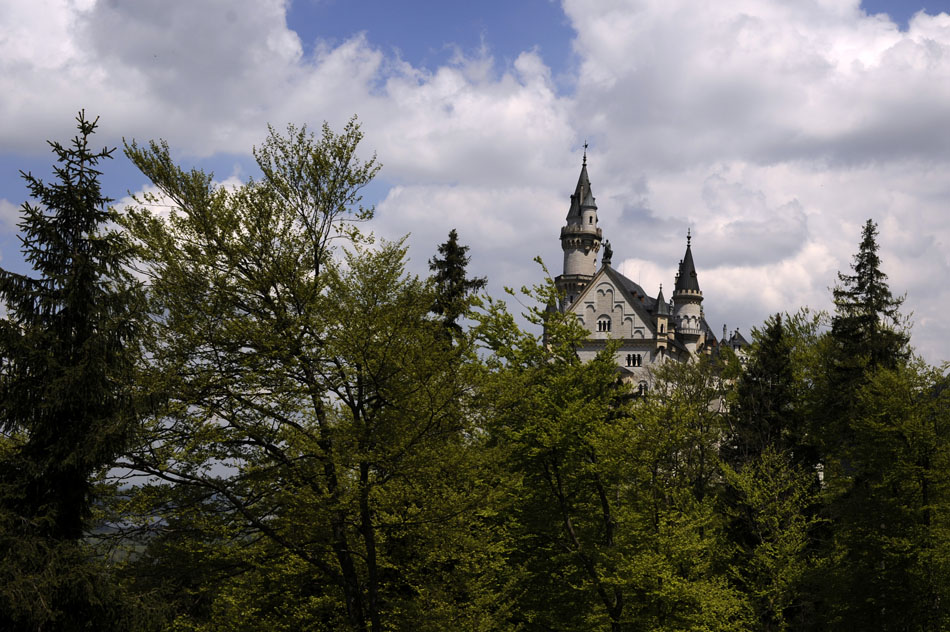 The top of Schloss Neuschwanstein peeks out from behind trees on Sunday, May 23, 2010, in Schwangau, Germany. It is said to be the world's most famous castle.