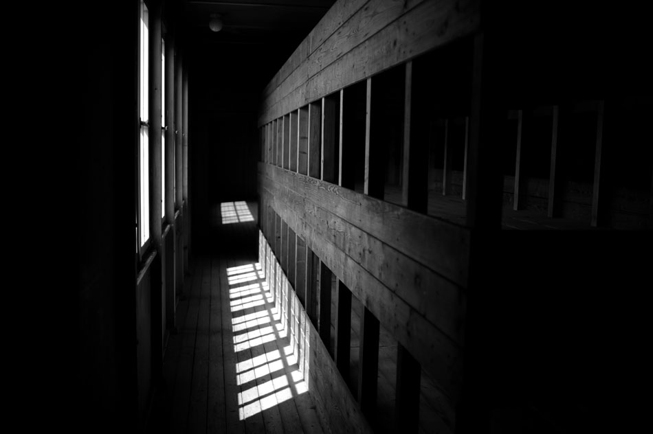 Light pours into a dark prisoner barrack on Saturday, May 22, 2010, at the Dachau Concentration Camp in Dachau, Germany.