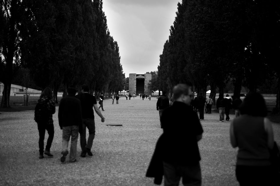 Visitors walk down the main camp road on Saturday, May 22, 2010, towards a memorial to Christians killed at the Dachau Concentration Camp in Dachau, Germany.