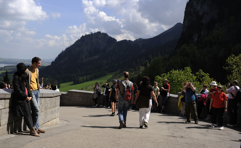 Visitors wait outside Schloss Neuschwanstein for their guided tours to begin on Sunday, May 23, 2010, near Schwangau, Germany. Good weather and a national holiday combined to attract several local and foreign visitors to the castle.