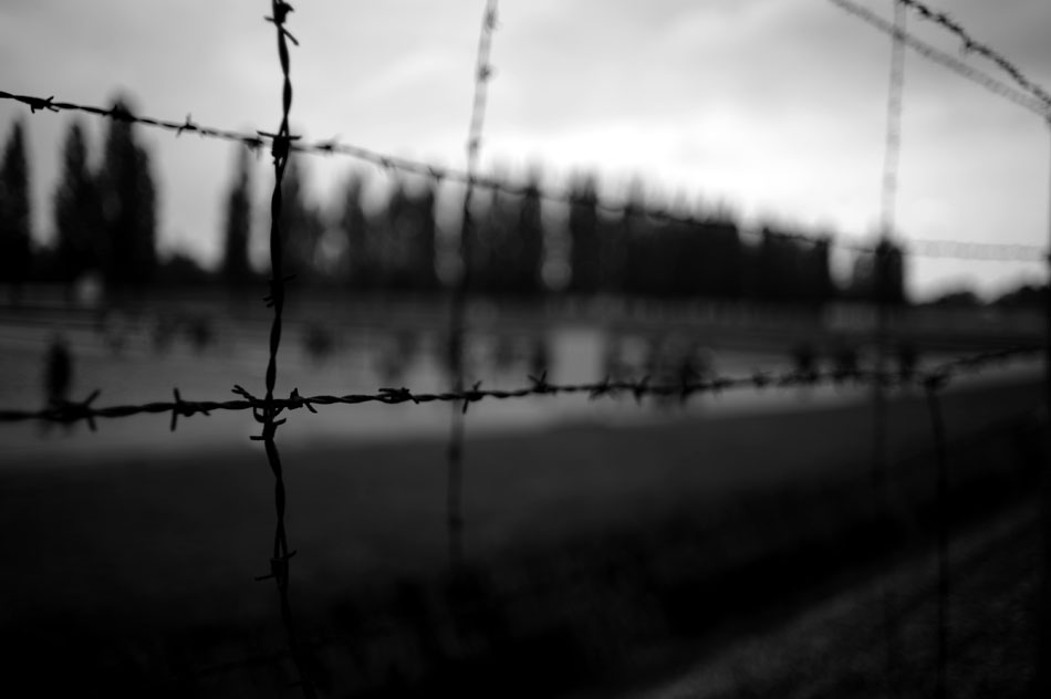A rusted barbed wire fence encircles the Dachau Concentration Camp, as seen on Saturday, May 22, 2010, in Dachau, Germany.