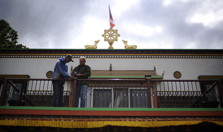 Volunteers work on a railing outside the Dalai Lama's room above the main temple on Saturday, May 8, 2010, at the Bloomington Tibetan Mongolian Buddhist Cultural Center. The Dalai Lama will visit Bloomington on May 12 and 14.