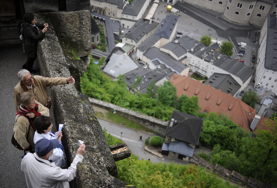 Visitors look northeastward on Friday, May 21, 2010, from the Salzburg Festung (Fortress) in Salzburg, Austria. The fortress was built starting in 1077.