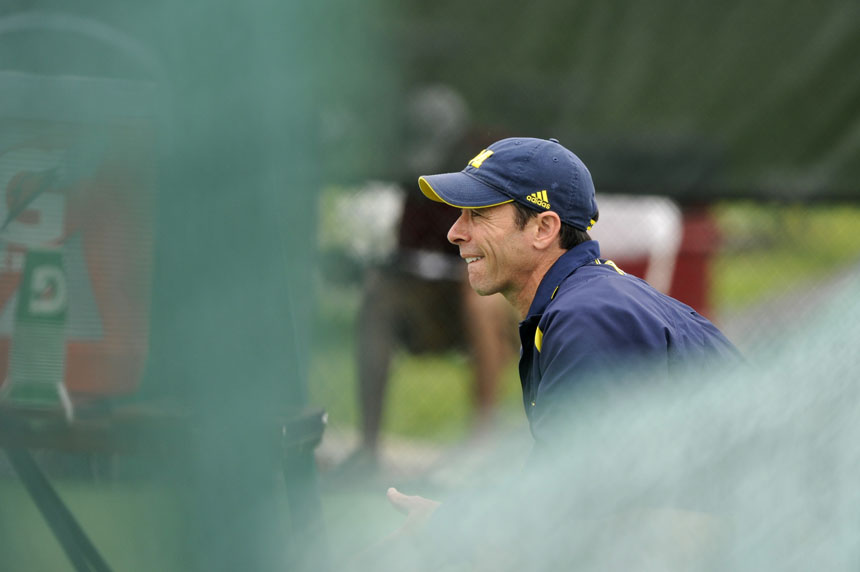 Michigan coach Bruce Berque watches the action during the Big Ten Men's Tennis Tournament on Saturday, May 1, 2010, at Indiana University in Bloomington, Ind.