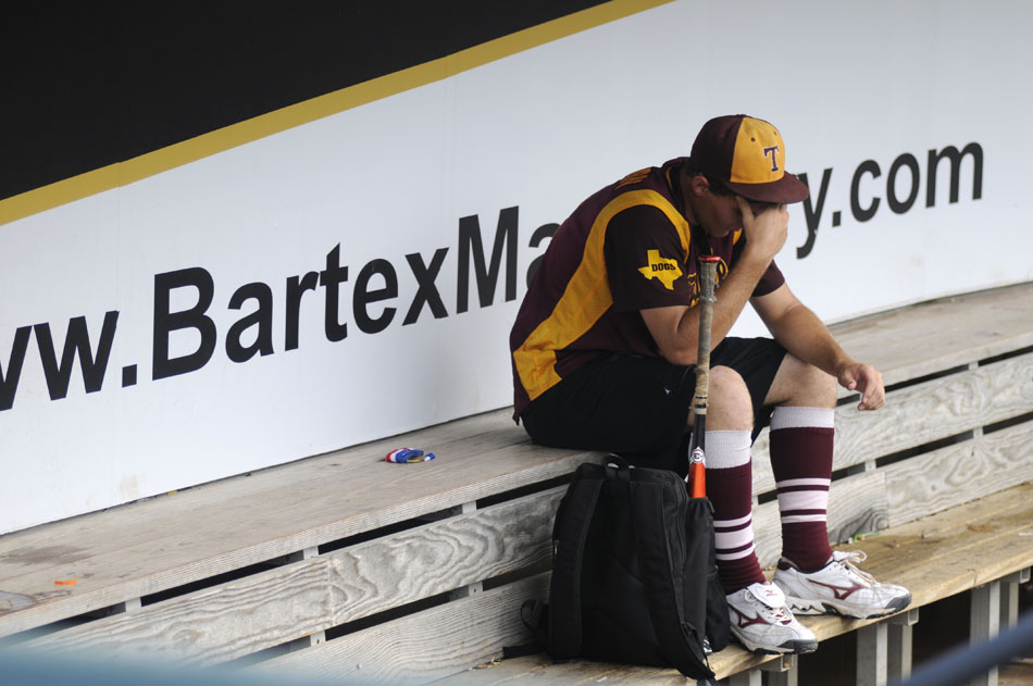 Thorndale's Paxton Jordan takes a moment to himself in the dugout after a 5-4 loss to Evadale in a Class 1A baseball semifinal at Dell Diamond in Round Rock on Wednesday, June 9, 2010.