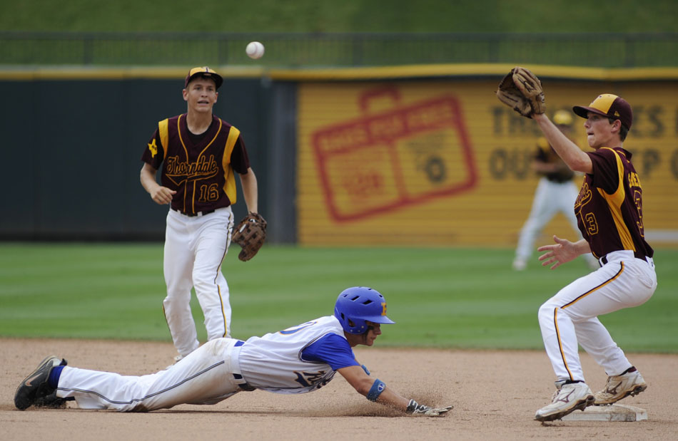 Evadale's Tyler Ousley dives back to second as Thorndale's Caleb Saunders, right, looks to tag him out during a Class 1A baseball semifinal at Dell Diamond in Round Rock on Wednesday, June 9, 2010.