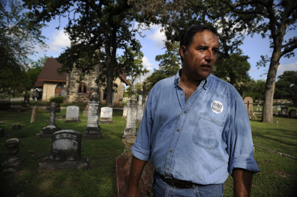 Dale Flatt, an organizer with Save Austin's Cemeteries, surveys an area of the Oakwood Cemetery on Wednesday, June 23, 2010. Flatt, a Austin firefighter, works to preserve and restore old headstones and grave sites through the organization.