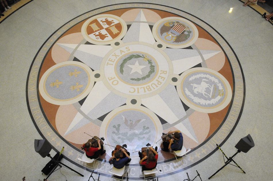Saline Fiddlers cellists perform for a group of visitors in the Texas State Capital rotunda on Wednesday, June 30, 2010. The group of high school students from Saline, Mich. are currently on a tour of Texas.
