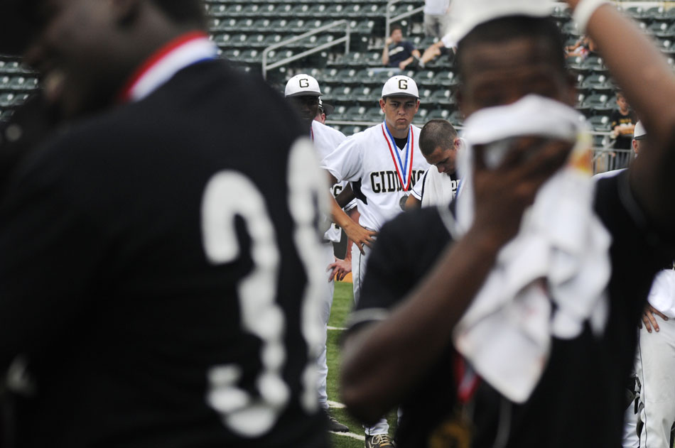 Giddings players watch as their Pleasant Grove counterparts receive first place medals after the Class 3A state championship game at Disch-Falk Field on Thursday, June 10, 2010. It is the second year in a row Giddings has finished second in the state.