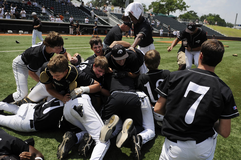 Pleasant Grove players dive into a pile in the infield after the final out in a 2-0 win against Giddings in the Class 3A state championship game at Disch-Falk Field on Thursday, June 10, 2010.