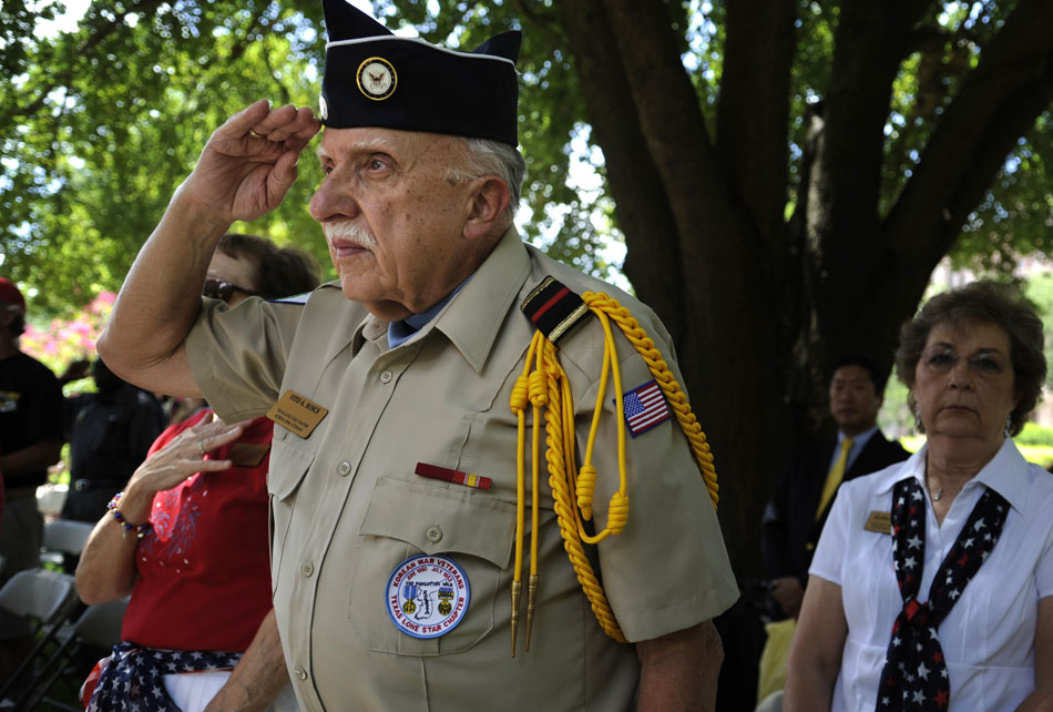 Korean War veteran Vito Susca salutes the flag during the playing of Taps at a ceremony marking the 60th Anniversary of the start of the Korean War at the Texas Korean War Veterans Memorial on Friday, June 25, 2010. Susca served four years in the Navy.