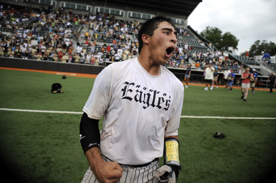 Rogers' Ryan Pierce celebrates his team's 6-1 victory over Bushland in the Class 2A championship game at Disch-Falk Field on Thursday, June 10, 2010.