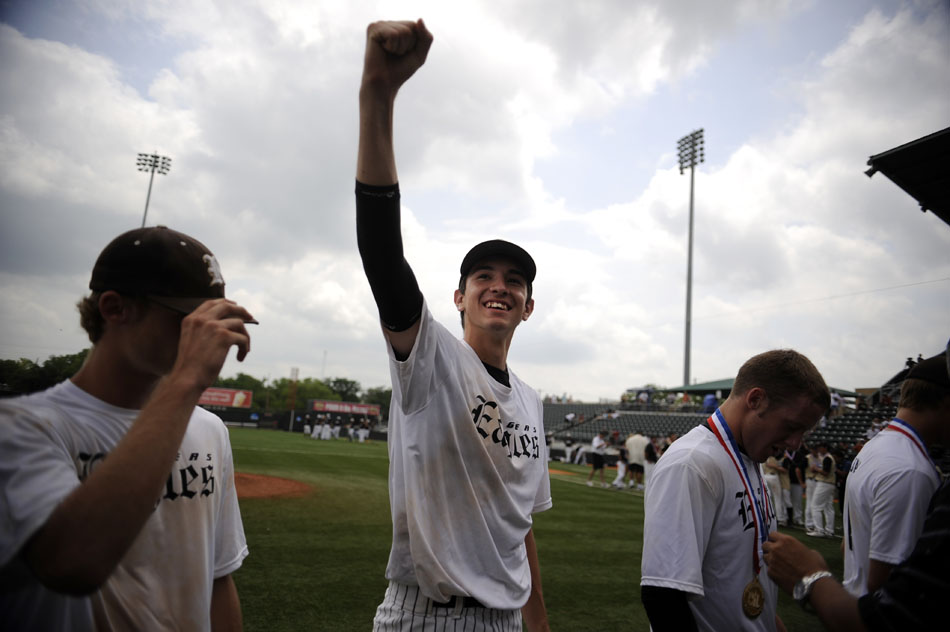 Rogers' Gregory Mendoza, center, pumps his fist to the stands after a 6-1 win against Bushland in the Class 2A state championship game at  Disch-Falk Field on Thursday, June 10, 2010.