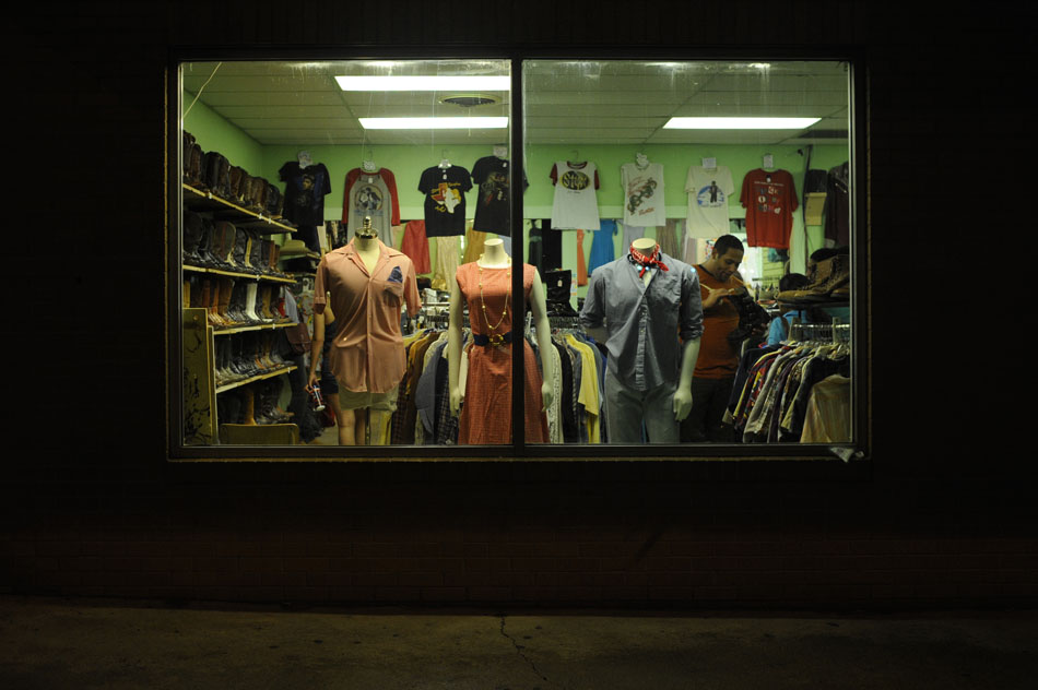 A man browses the selection at a SoCo clothing shop during First Thursday on Thursday, July 1, 2010. Several SoCo shops stay open late for customers on the first Thursday of each month.