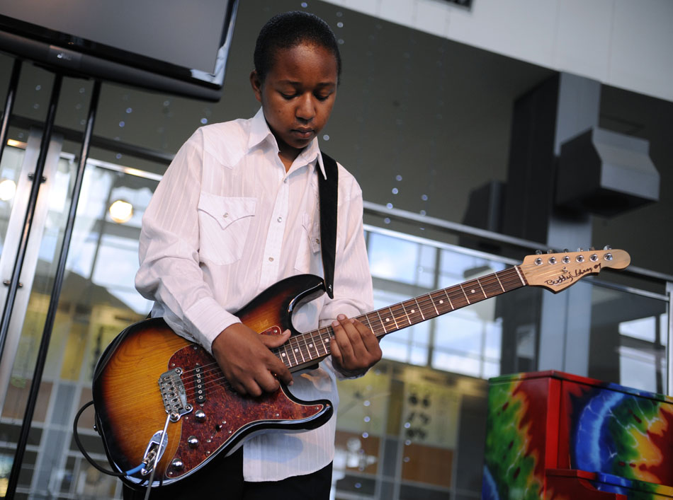 Glenn Peterson Jr., age 13, performs with the Peterson Brothers Band at Ray Benson's Roadhouse in Bergstrom International Airport on Monday, July 19, 2010.