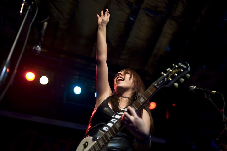 Goodnight Lane guitarist and singer Janel Duarte waves to the crowd after a song in her band's set during the Rock Camp USA concert at Antone's on Saturday, July 24, 2010.
