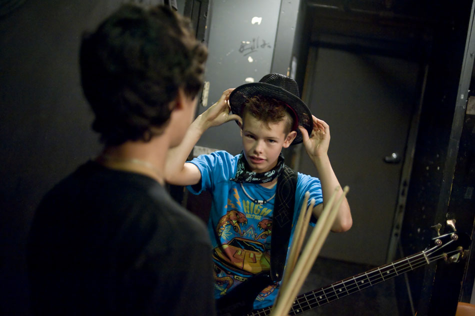Marlon Sexton straightens his hat before heading out to play a set during the Rock Camp USA concert at Antone's on Saturday, July 24, 2010.