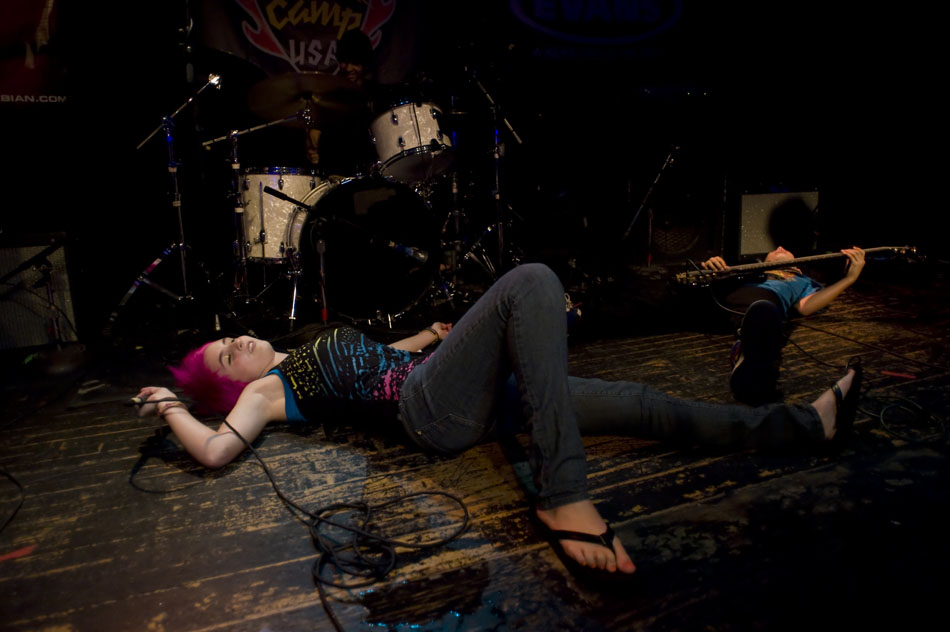 Hatin' on the Hair singer Maddie Rogers, age 14, acts as though she's collapsed to the stage at the end of her band's set during the Rock Camp USA concert at Antone's on Saturday, July 24, 2010.