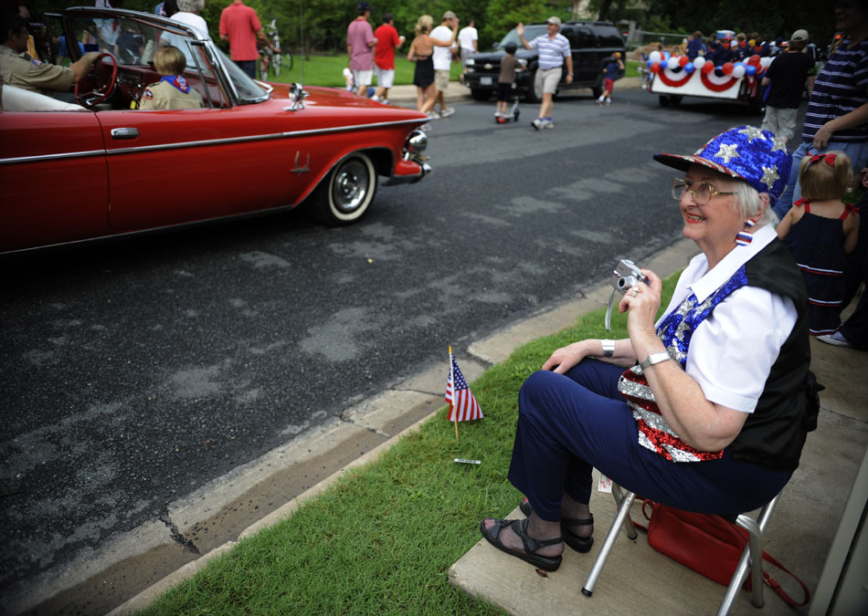 With her camera ready, Margaret Walker prepares to snap a few pictures of youngsters in the Tarrytown Fourth of July parade on Saturday, July 3, 2010. "It's always the same, but I love it," she said of the annual parade.