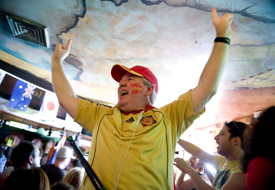 Spanish fan Pete Hoyt celebrates Spain's 1-0 win over the Netherlands in the World Cup championship game alongside fellow Spanish fans at Fado Irish Pub on Sunday, July 11, 2010. The win was Spain's first in the World Cup.