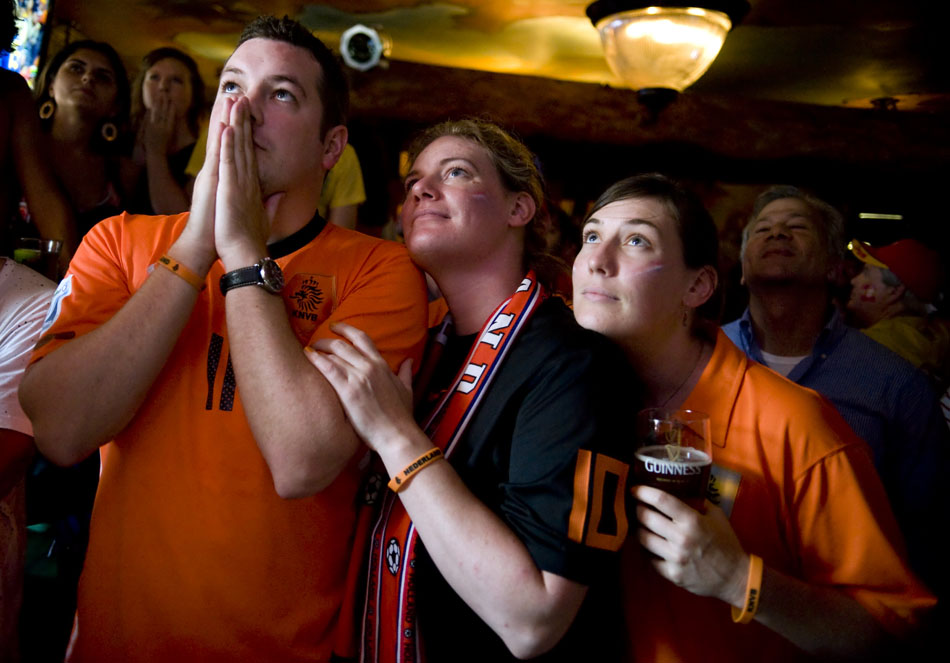 Dutch fans and siblings Ryan, Vanessa and Ashley Colpaart nervously watch the action in the World Cup championship game at Fado Irish Pub on Sunday, July 11, 2010.
