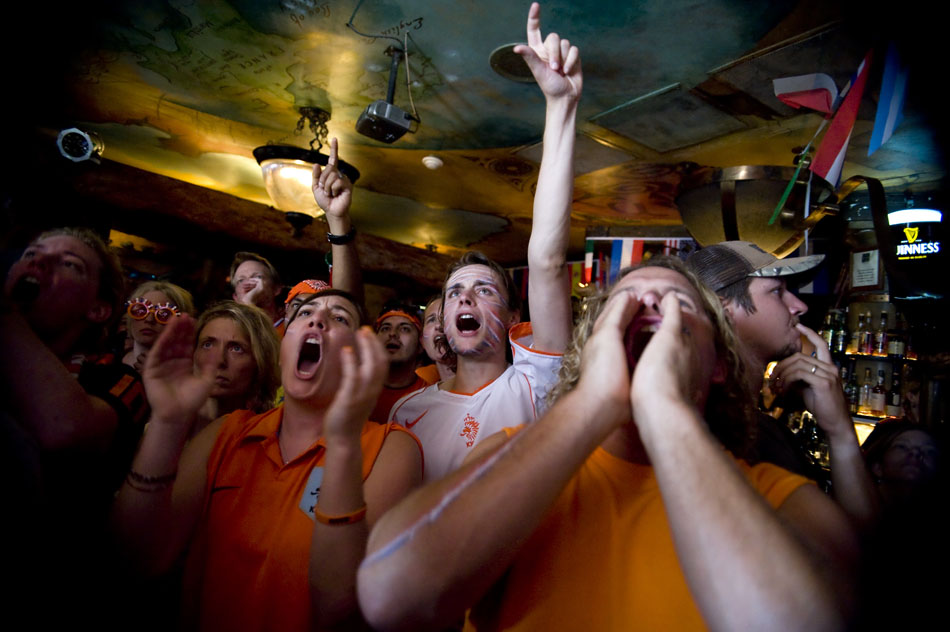 Dutch fans cheer during the World Cup championship game between the Netherlands and Spain at Fado Irish Pub on Sunday, July 11, 2010.