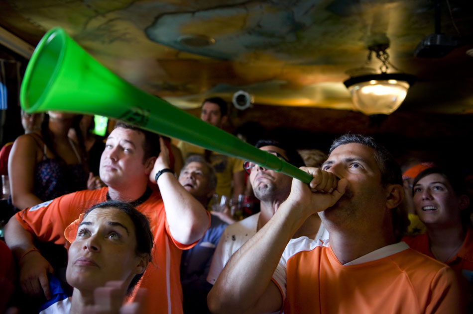 A supporter of Holland plays a vuvuzela in Fado Irish Pub as he and other Dutch supporters cheer on their team against Spain in the World Cup final on Sunday, July 11, 2010.