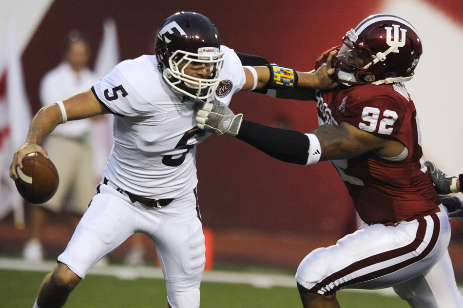 Eastern Kentucky quarterback Cody Watts, left, tries to avoid IU's Greg Middleton during a game against Eastern Kentucky on Thursday, Sept. 3, 2009, at Memorial Stadium. Watts fumbled the ball in the end zone on the play, resulting in a safety.
