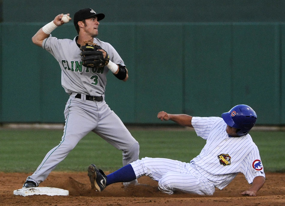 LumberKings shortstop Nick Franklin (3) prepares to throw to first after forcing Chiefs right fielder Jae-Hoon Ha out at second base during a game on Saturday, Aug. 28, 2010, at O'Brien Field.