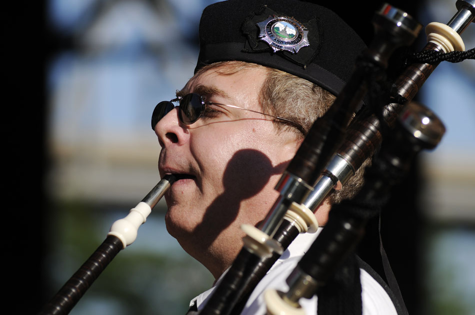 Craig Thacker plays the bagpipes near the main entrance of the Erin Feis Festival on Friday, Aug. 27, 2010, on the Peoria Riverfront. Thacker plays with the Illinois Elks, and will be greeting visitors with his tunes near the entrance this weekend.