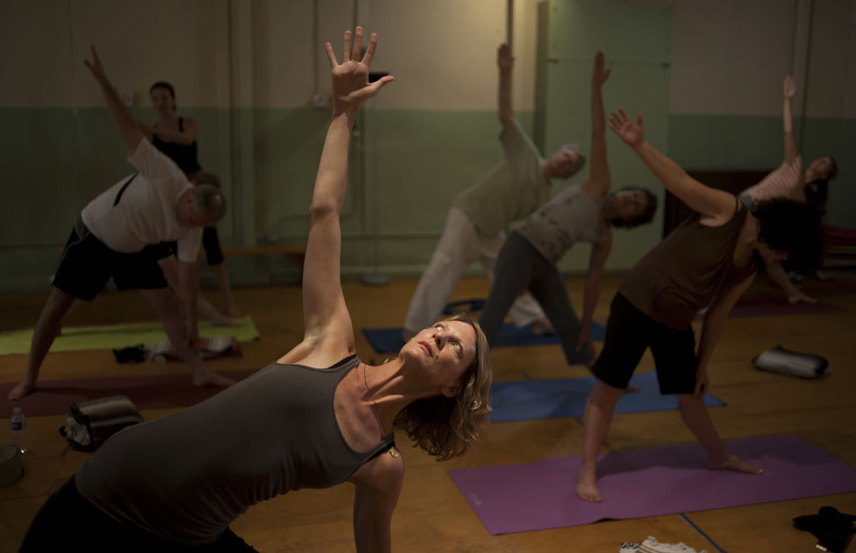 Jyl Kutsche, an organizer for Community Yoga, participates in a class at Casa de Luz on Sunday, Aug. 1, 2010. The classes collect donations and use the proceeds to teach yoga to underprivileged citizens who can't afford the classes.