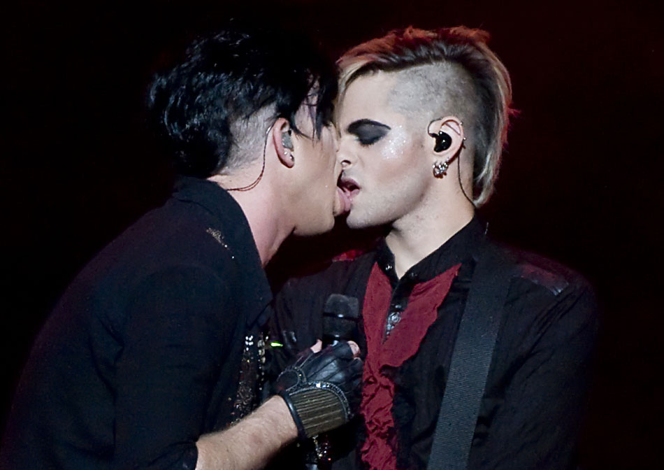 Singer Adam Lambert exchanges a kiss with his bassist Tommy Joe Ratliff during a performance on Sunday, Sept. 5, 2010, at the Peoria Civic Center. Lambert, who is opening gay, made waves after kissing Ratliff on national television.
