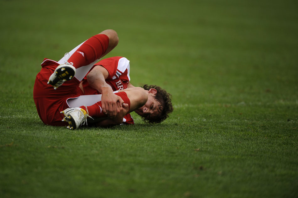 Bradley's Ross Williams grabs his leg in pain after colliding with SMU keeper Craig Hill, not pictured, outside the box trying to score during a game on Saturday, Sept. 19, 2010, at Shea Stadium in Peoria. Hill received a yellow card for the collision, but SMU won 3-1.