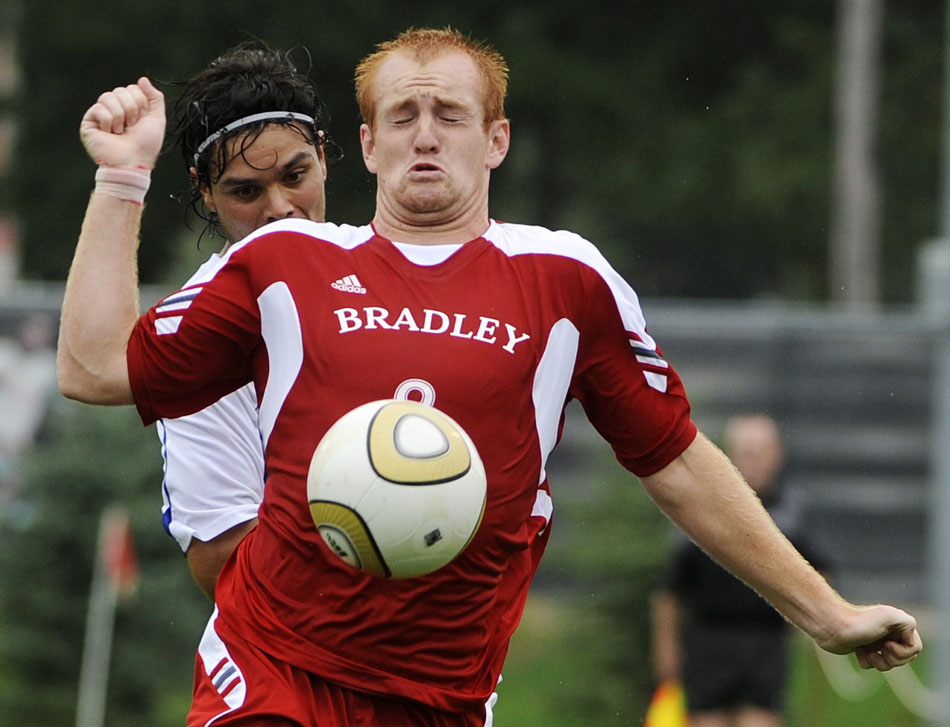 Bradley's Jochen Graf plays the ball in front of SMU's Leone Cruz during a game on Saturday, Sept. 19, 2010, at Shea Stadium in Peoria. SMU won 3-1.