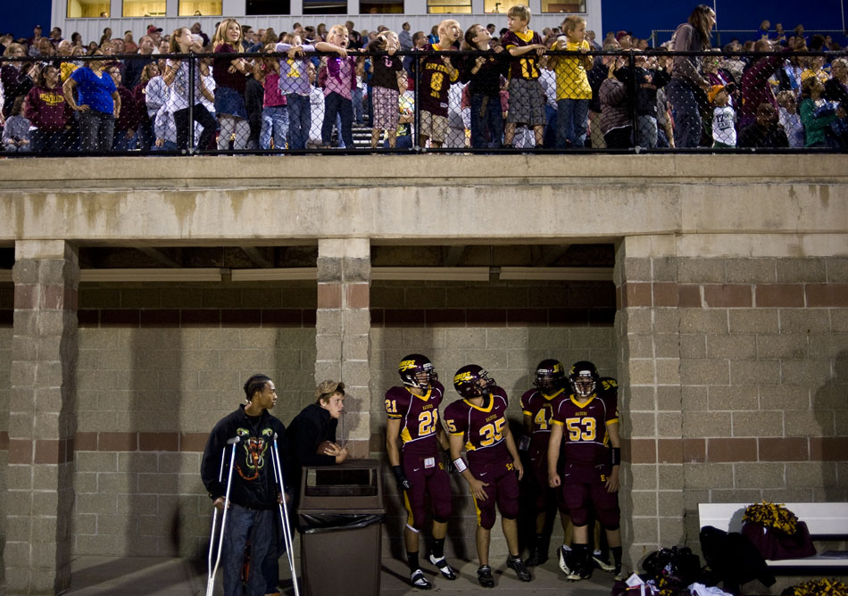 East Peoria players wait for the end of a fireworks display to run onto the field to take on Washington on Friday, Sept. 10, 2010, in East Peoria.