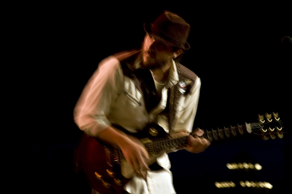Easy Riders guitarist Mike Miller glances back at a keyboardist during the band's performance at the Illinois Blues Festival on Friday, Sept. 3, 2010, at the Riverfront.
