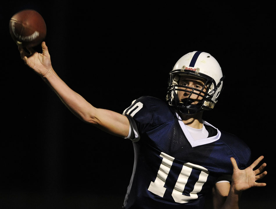 Peoria Notre Dame's Guy Dillon passes in a game against Quincy Notre Dame on Thursday, Sept. 16, 2010, in Peoria.