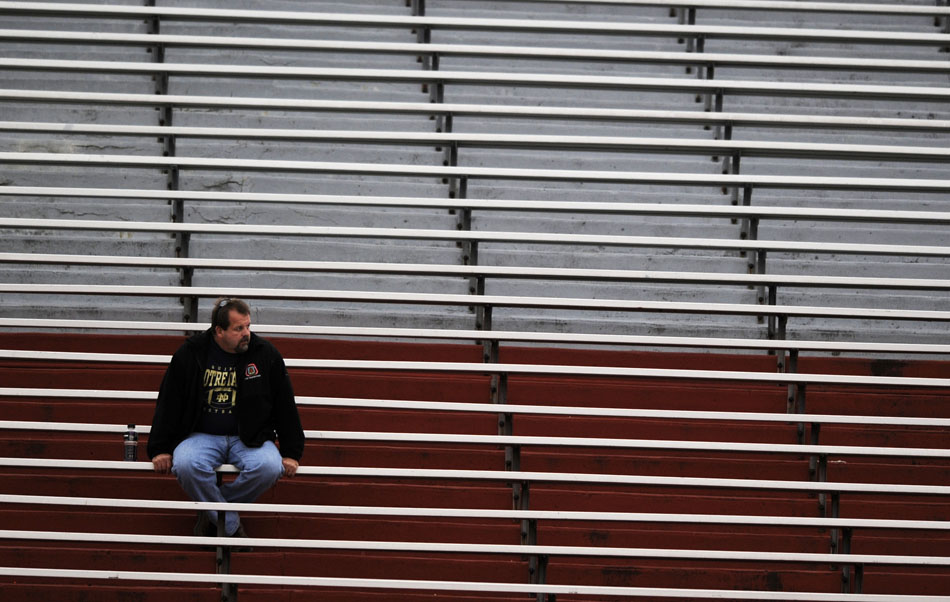A Quincy Notre Dame fan awaits the start of a game against Peoria Notre Dame on Thursday, Sept. 16, 2010, in Peoria.