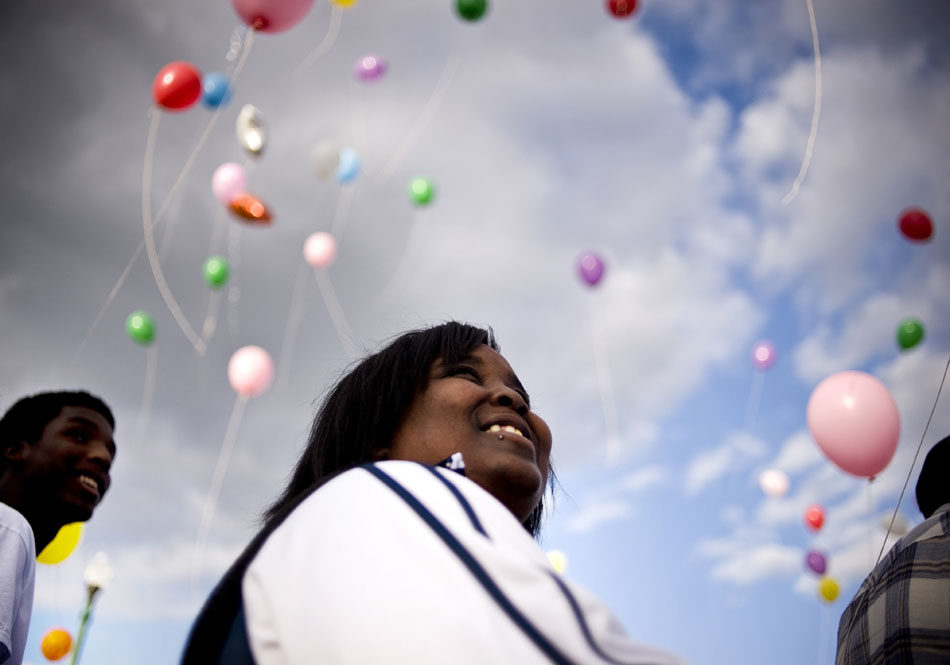 Marion English looks skyward as she tracks the flight path of her balloon as it sails southwest over the Interstate 74 bridge during a launch as part of the National Day of Remembrance on Sunday, Sept. 26, 2010, at the RiverPlex. English was on hand to remember her 19-year-old niece Jasmine Brittine who was fatally shot on March 21, 2010.