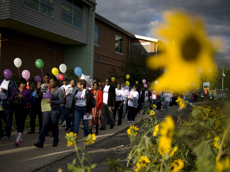 A large crowd of a few hundred people take part in a remembrance walk during the National Day of Remembrance on Sunday, Sept. 26, 2010, at the RiverPlex. The day is for grieving families and friends of people who were killed through violence.